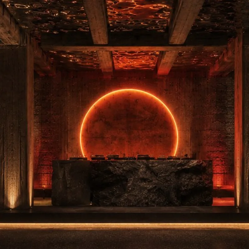 The Eclipse glowing over the stone DJ booth