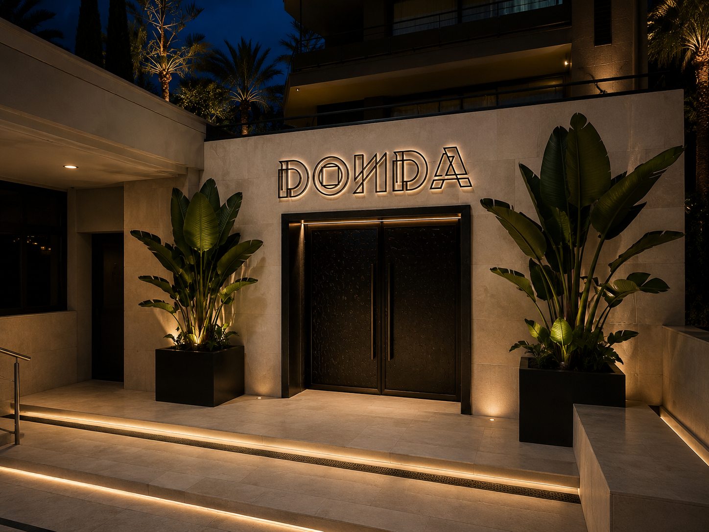 The DONDA door on the Paseo at dusk, the wordmark lit above the doors