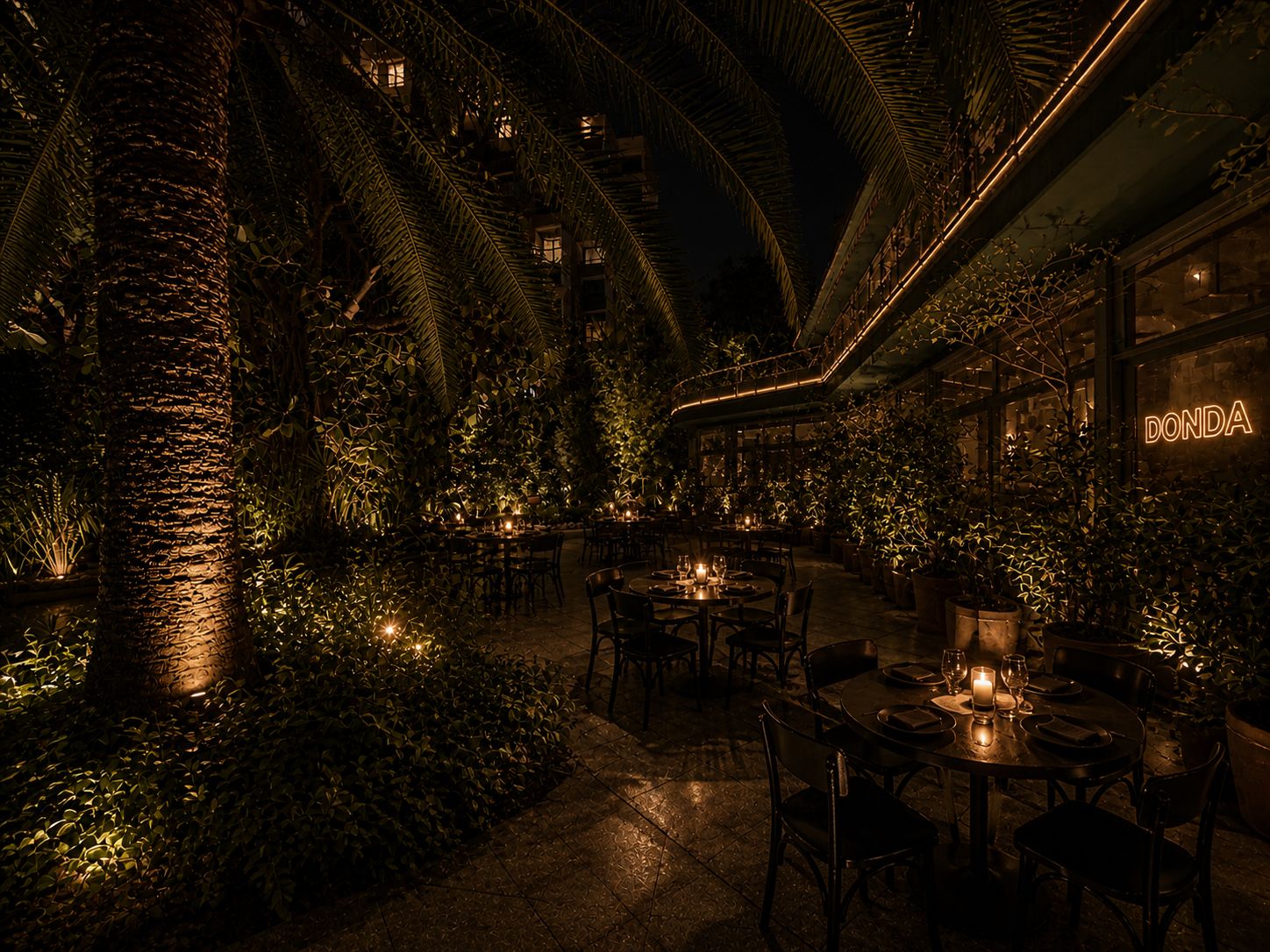 The Secret Garden at night: palms, candle-lit tables, DONDA neon glowing on the back wall
